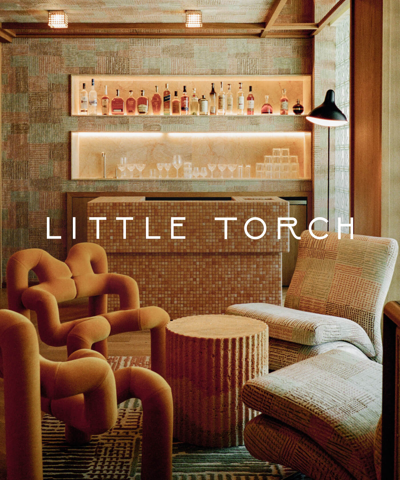 Little Torch lounge interior with tiled bar and warm seating